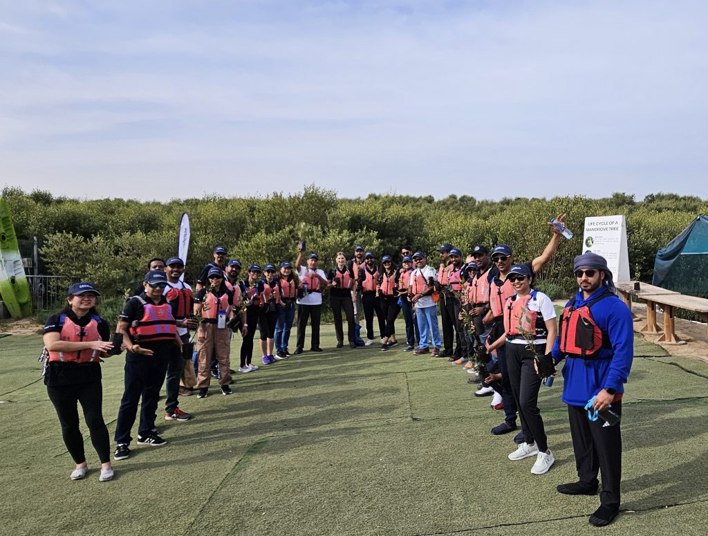 Unique Group's team participating in mangrove afforestation initiative